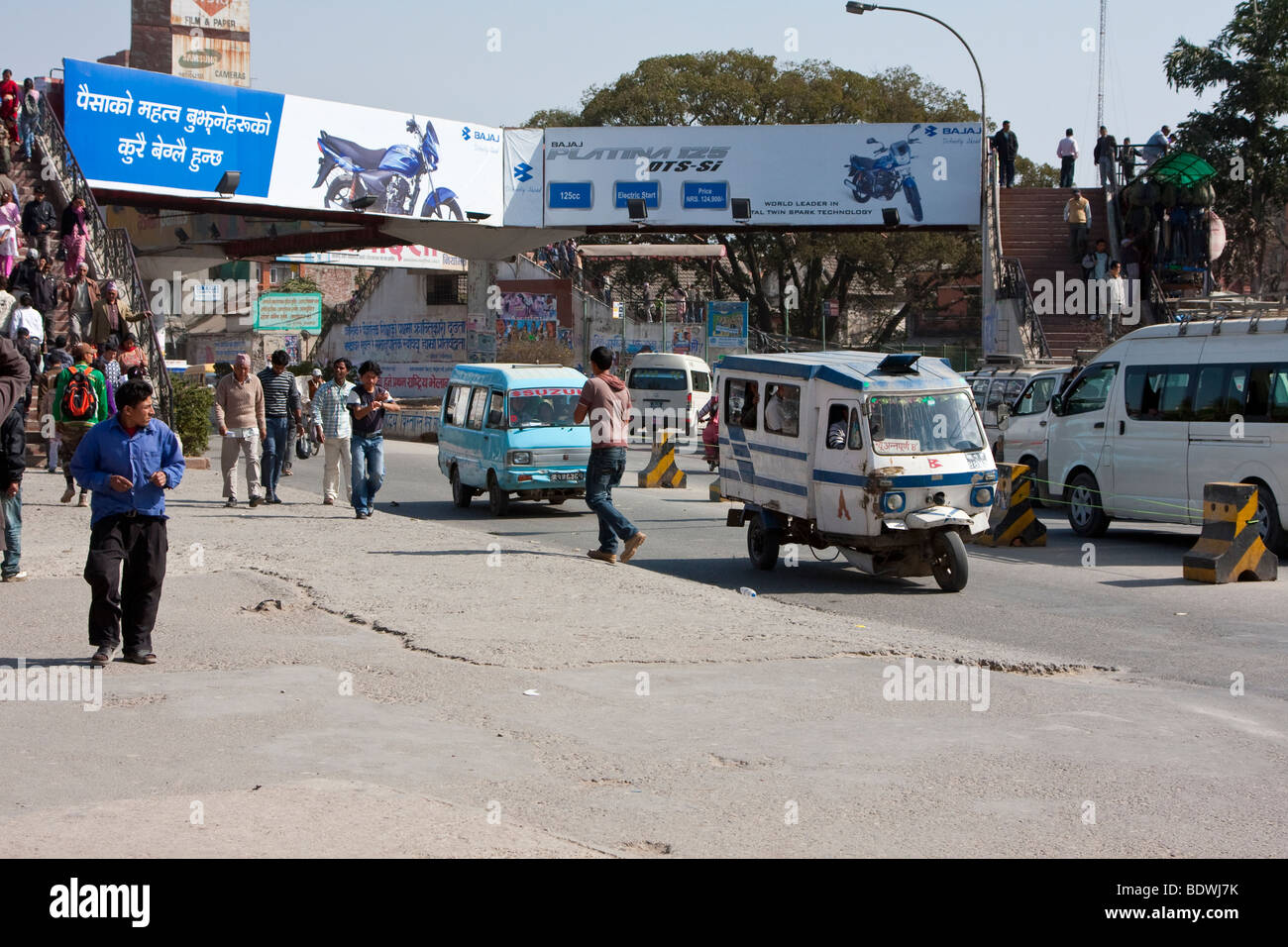 Kathmandu, Nepal. Street Scene with Taxi, Minibuses, including a Three-Wheeled Taxi ('Tuk Tuk') Stock Photo