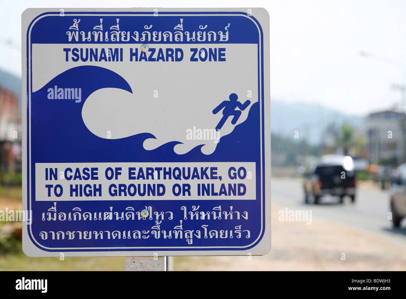 Tsunami warning sign on road showing escape routes, evacuation route, Khao Lak, Phuket, Thailand, Asia Stock Photo