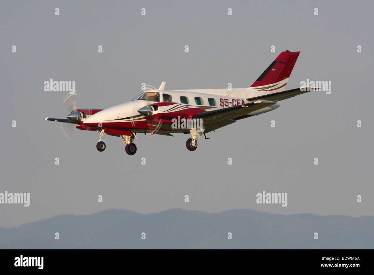 Beechcraft A60 Duke twin-engine light private prop plane on approach Stock Photo