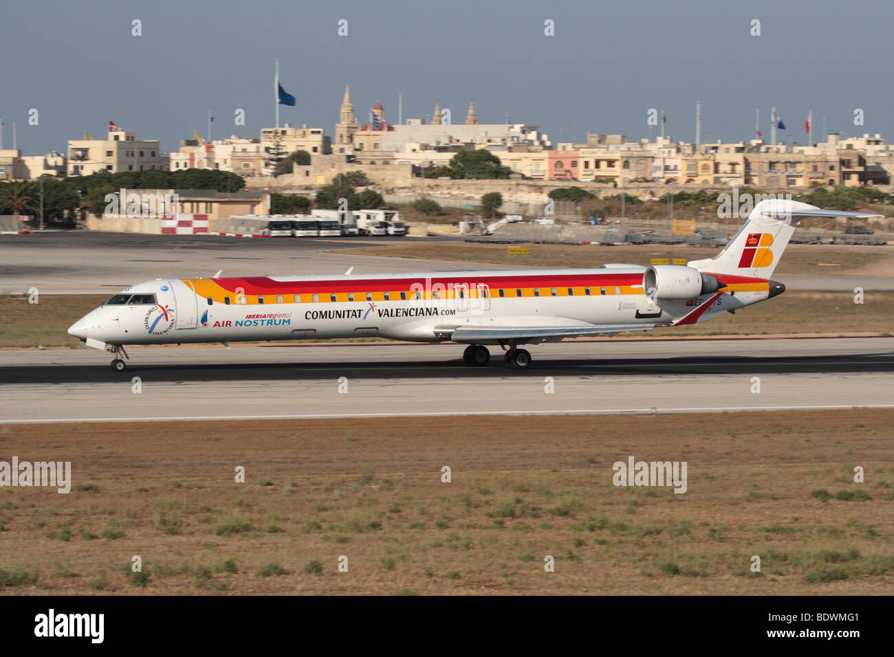 Air Nostrum (Iberia Regional) Bombardier CRJ900 small passenger jet airplane departing from Malta Stock Photo