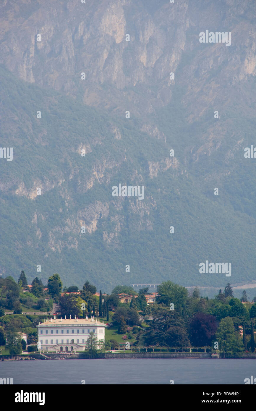 View of Villa Melzi, Bellagio across Lake Como with the mountains behind Stock Photo