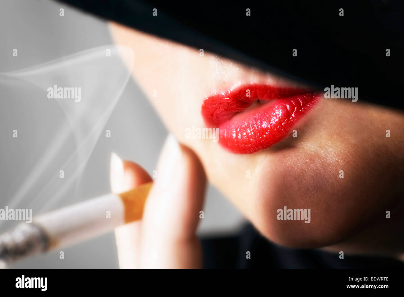 Woman lipstick smoking hi-res stock photography and images - Alamy