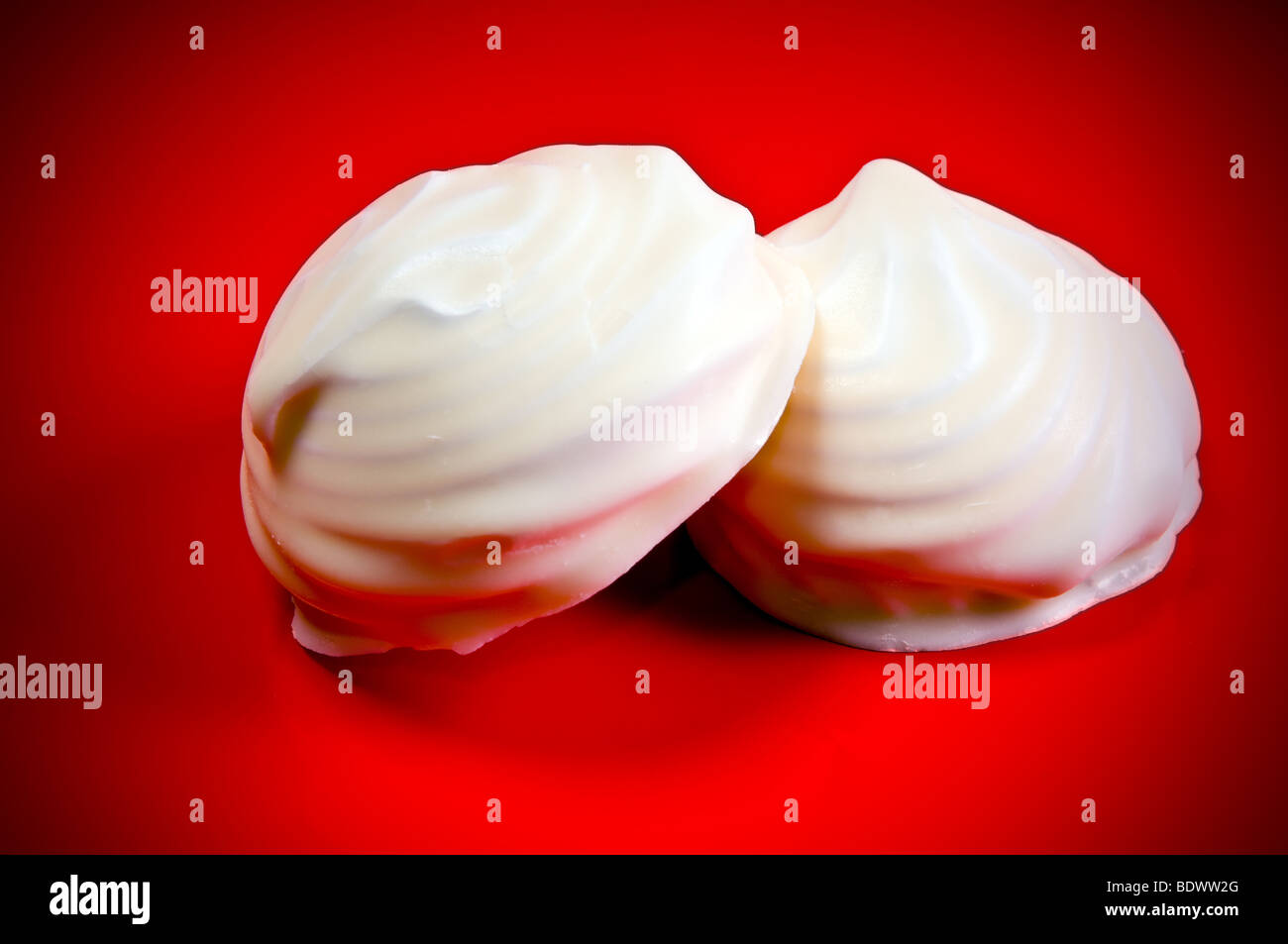 marshmallow zephyr cakes on red background Stock Photo