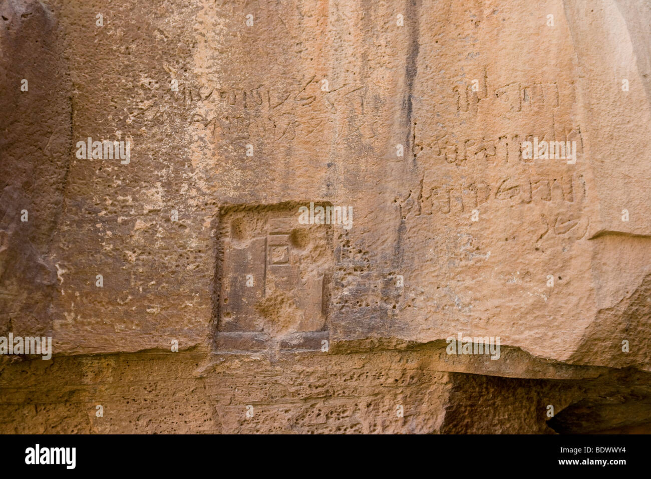 Ancient Rock Inscription at Lawrences Spring or Ain Shalaaleh in Wadi Rum Jordan Stock Photo