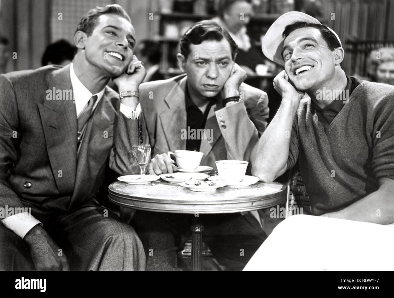 AN AMERICAN IN PARIS - 1951 MGM film with from l: Georges Guetary, Oscar Levant and Gene Kelly Stock Photo - Alamy
