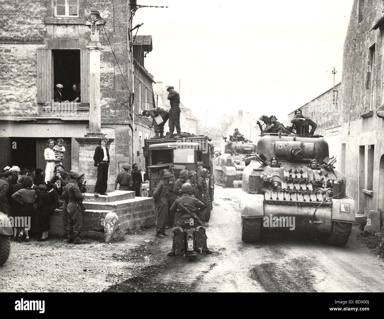 OPERATION OVERLORD  3rd Canadian division with Sherman tanks in village of Reviers after assaulting JUNO beach ton 6 June 1944. Stock Photo