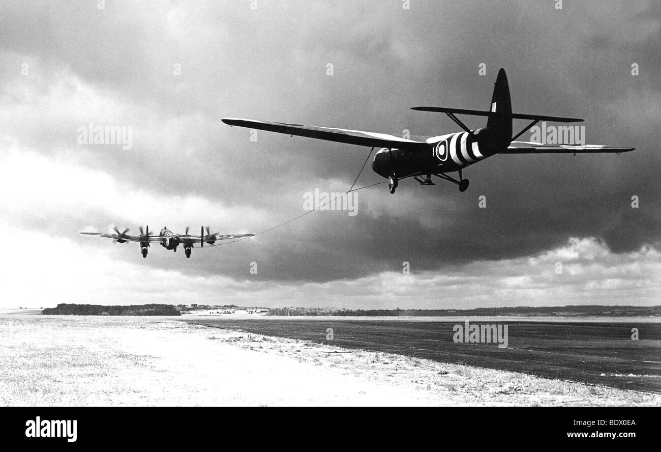 6 JUNE 1944 - A Halifax tows a Horsa glider from a UK airfield hading for France Stock Photo