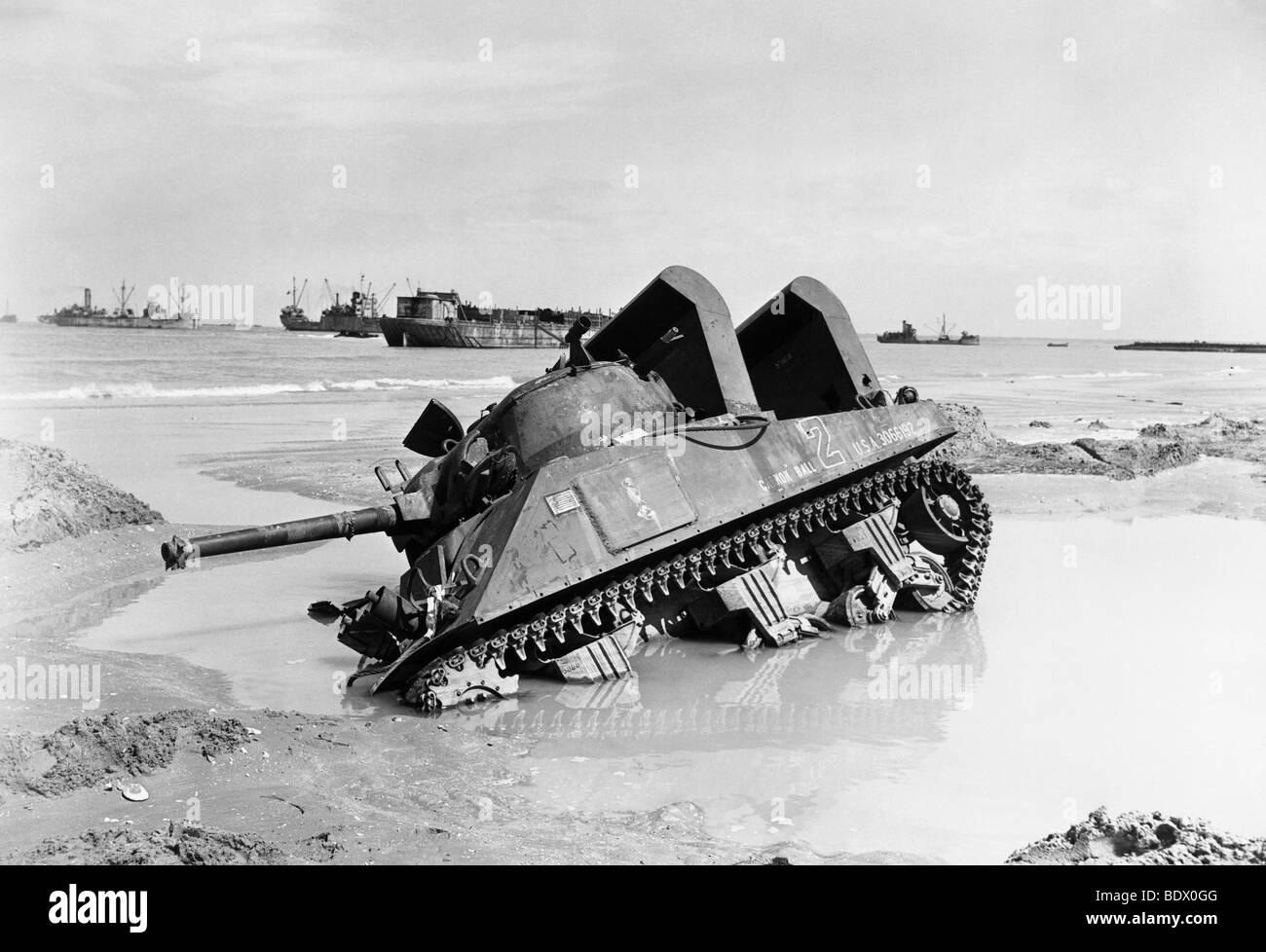 6 JUNE 1944 - stranded Sherman tank nick-named Cannon Ball on Utah beach. Note special air intakes for semi-submerged landing Stock Photo