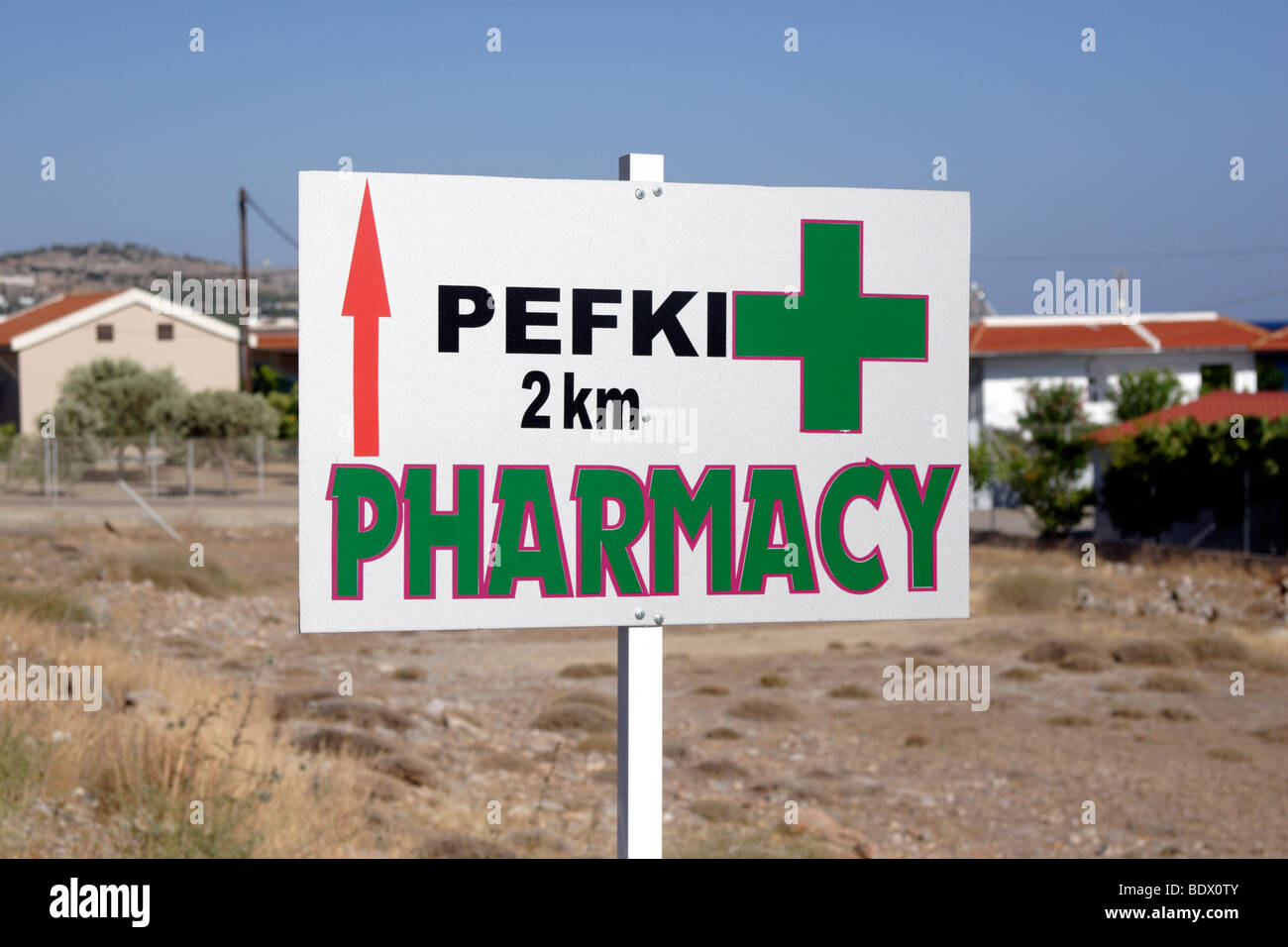 Pefki Pharmacy sign post , Rhodes , Dodecanese , Greece Stock Photo
