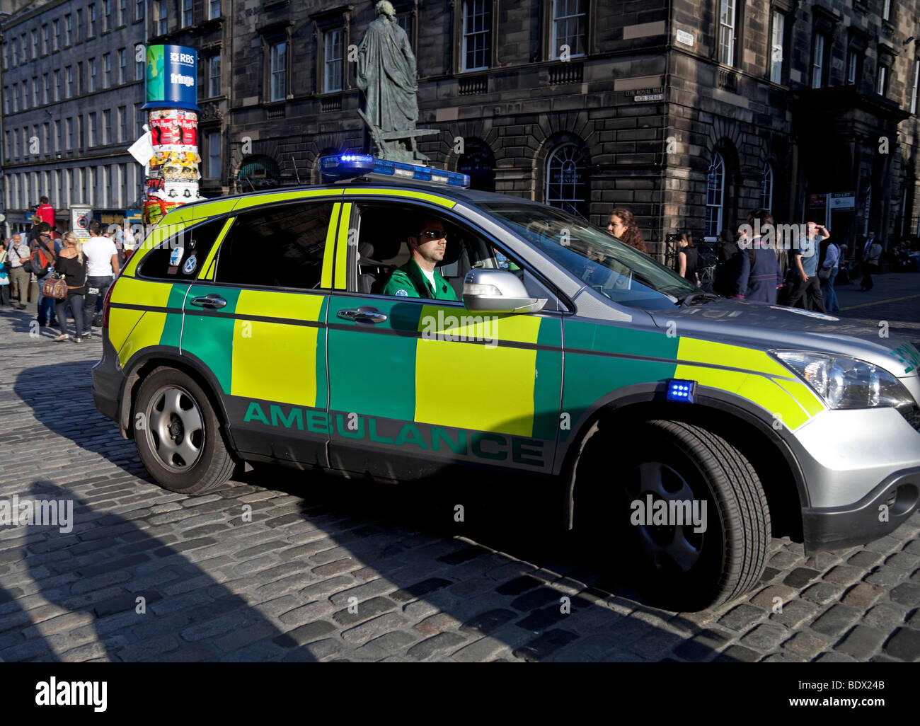 Ambulance vehicle with flashing emergency blue lights Edinburgh Scotland Stock Photo