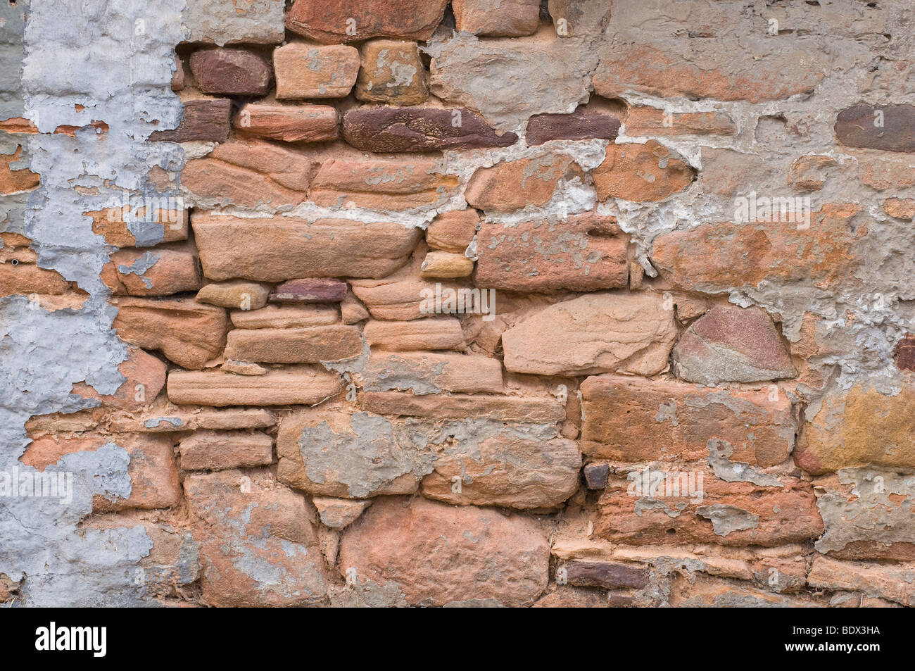 Formerly plastered sandstone wall, background Stock Photo Alamy