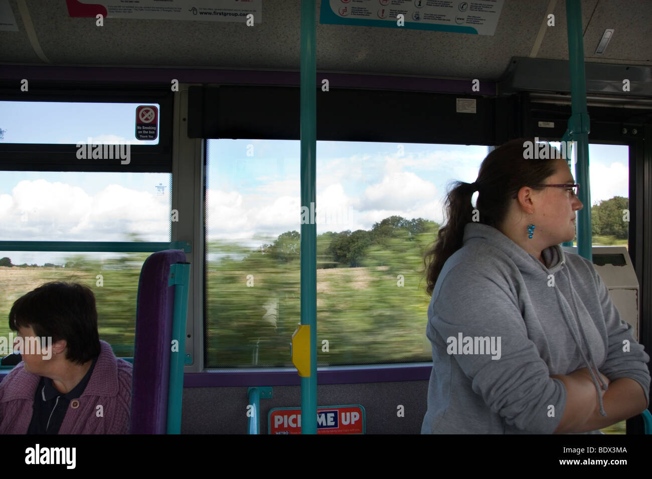 Travel Directions By Bus An Interior View Bus Traveling Through Countryside With 2 Passengers  Looking In Opposite Directions Stock Photo - Alamy
