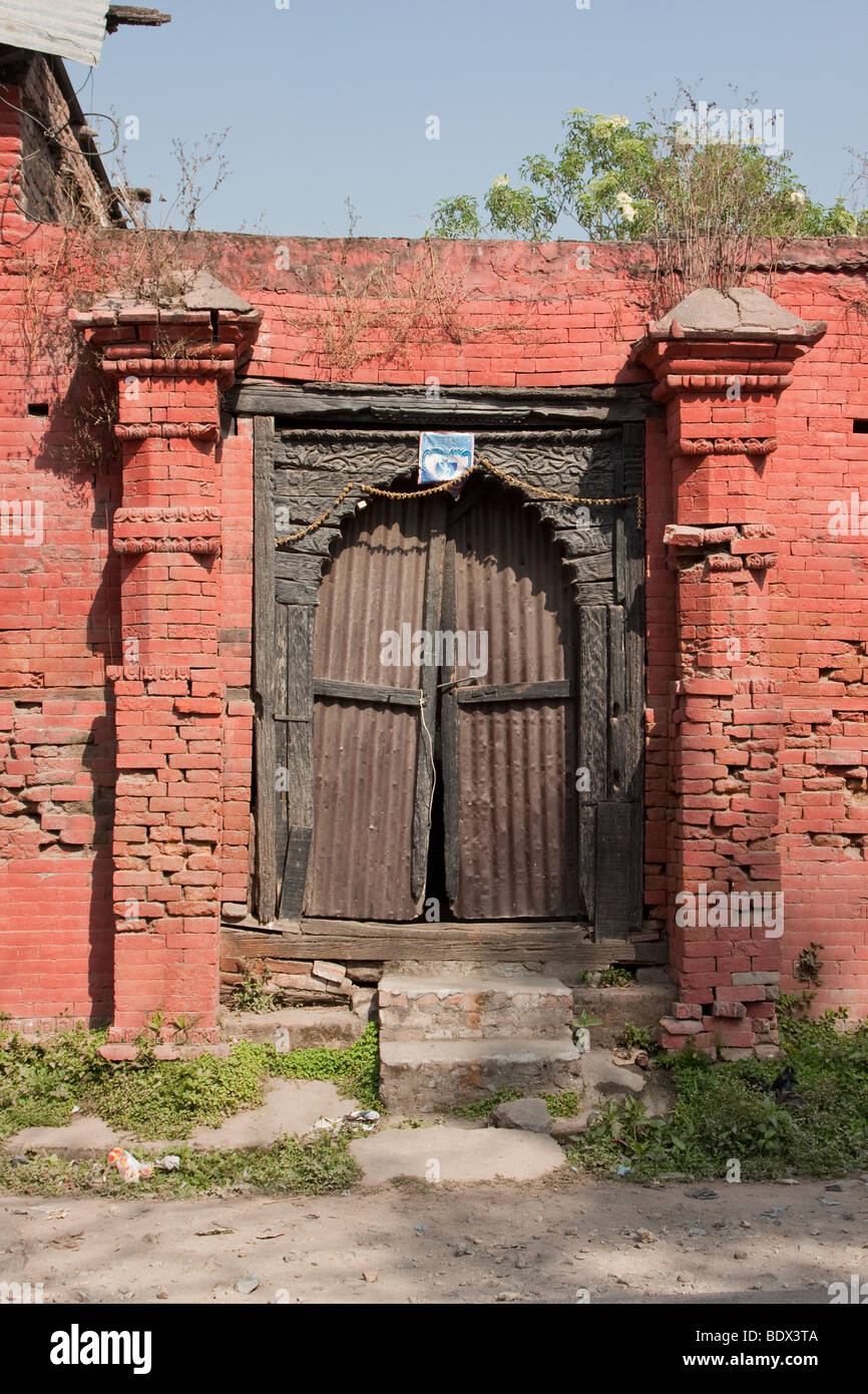 Kathmandu, Nepal. Entrance to a neglected neighborhood temple illustrates the need for preservation or restoration. Stock Photo