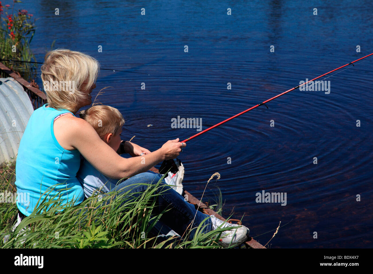 Boy fishing in creek hi-res stock photography and images - Alamy