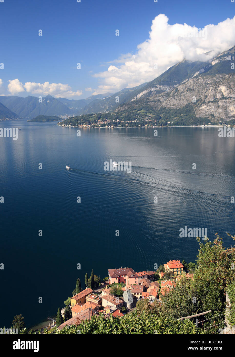 The Italian town of Varenna seen from the village of Vezio, with two ferries crossing Lake Como in the middle distance, Italy, Europe Stock Photo