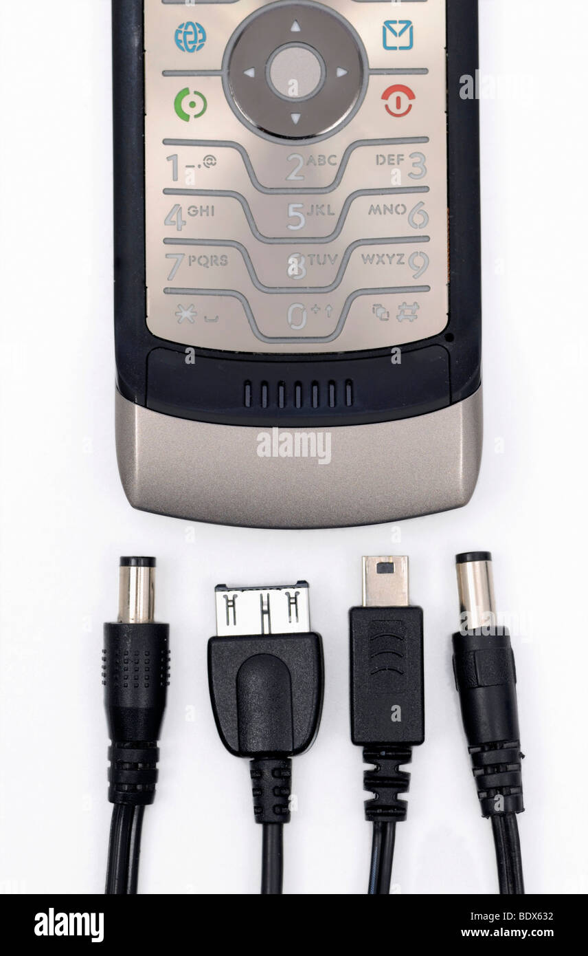 Mobile phone and chargers with different plugs Stock Photo - Alamy