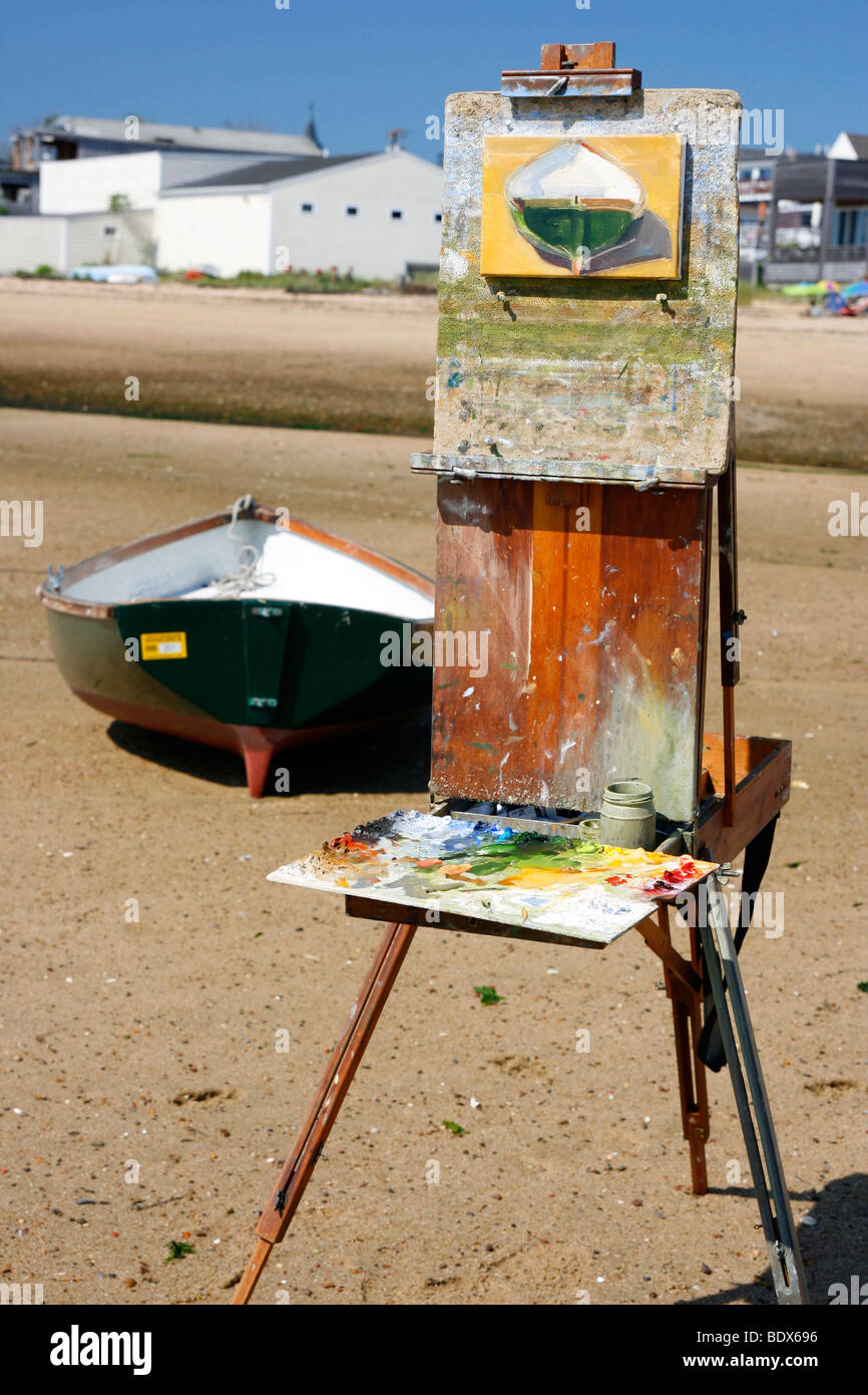 Painting of boat on an artist's easel. Stock Photo