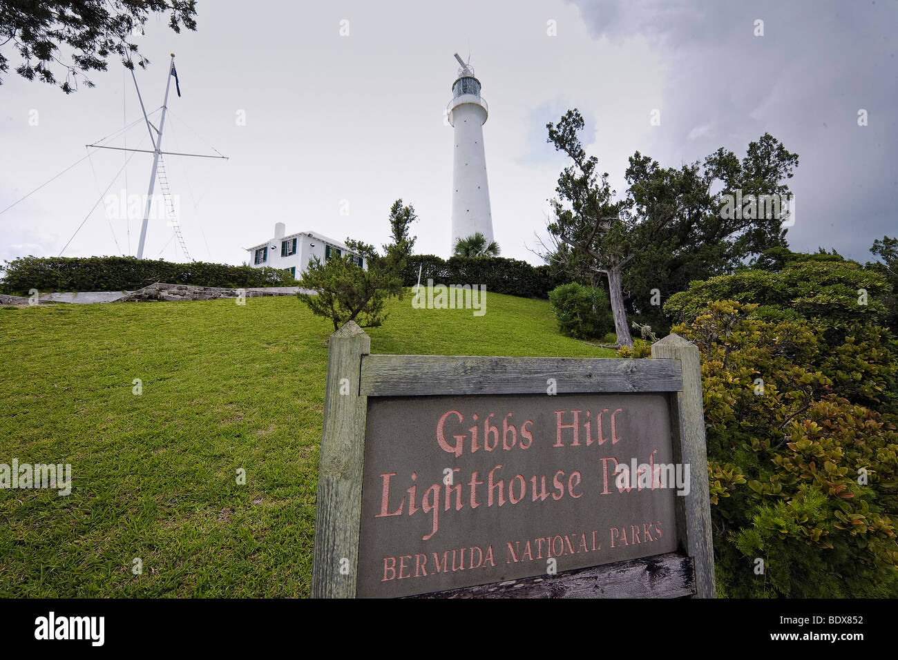 Low Angle View of a Lighthouse with a Sign, Gibbs Hill Lighthouse, Bermuda Stock Photo