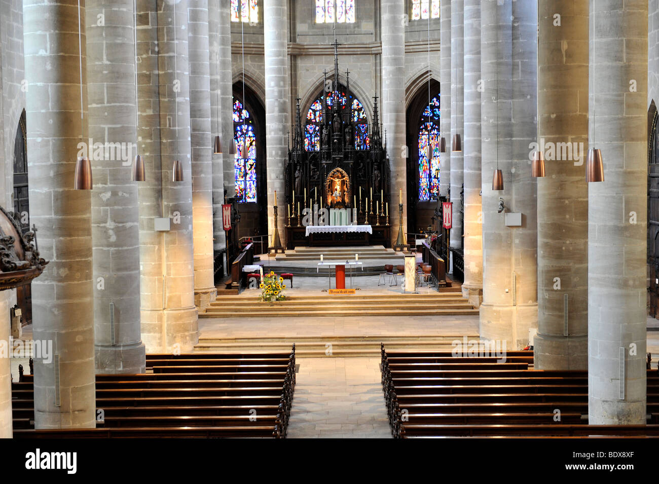 Interior of nave and neogothic high altar in the choir room with apse chapels, Heilig-Kreuz-Muenster Holy Cross cathedral, Sout Stock Photo