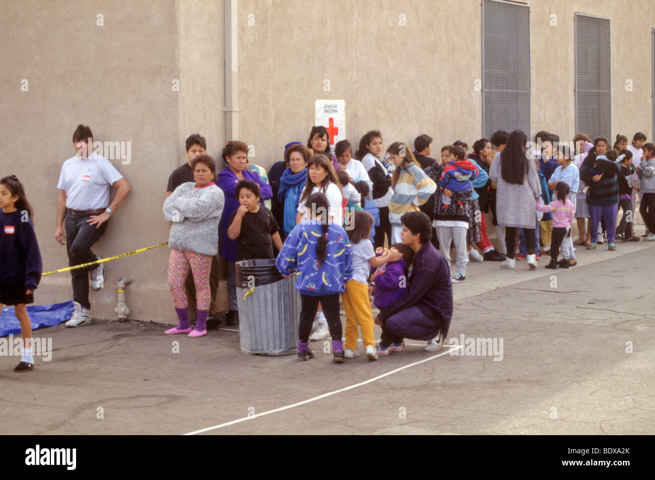 People Line Up For Food And Other Assistance After Major