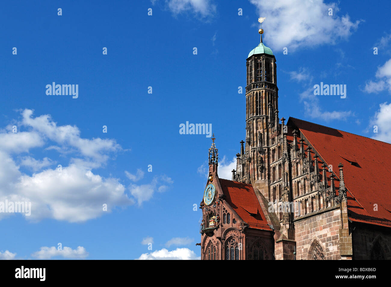 Gabled roof and turret clock with a carillon of the Frauenkirche Church of Our Lady, Gothic, circa 1355, before sky, Nuremberg, Stock Photo