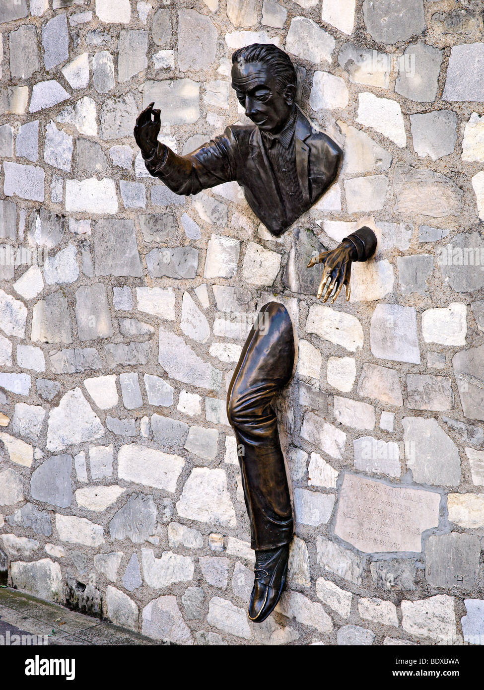 The statue; Le Passe Muraille at Montmartre, Paris, France. Stock Photo