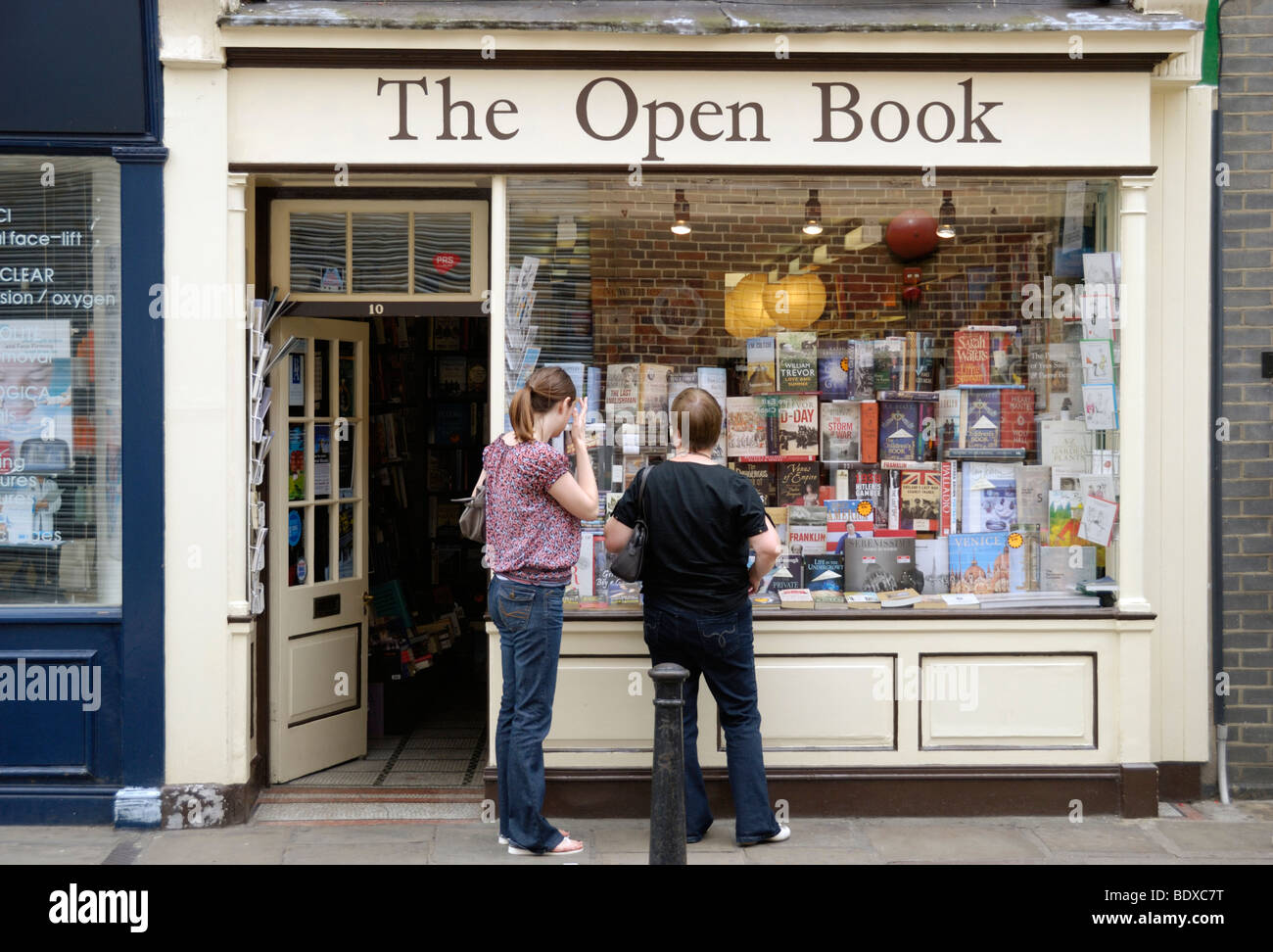Two women outside bookshop called the ' Open Book ', Richmond-upon-Thames, London, England, UK Stock Photo