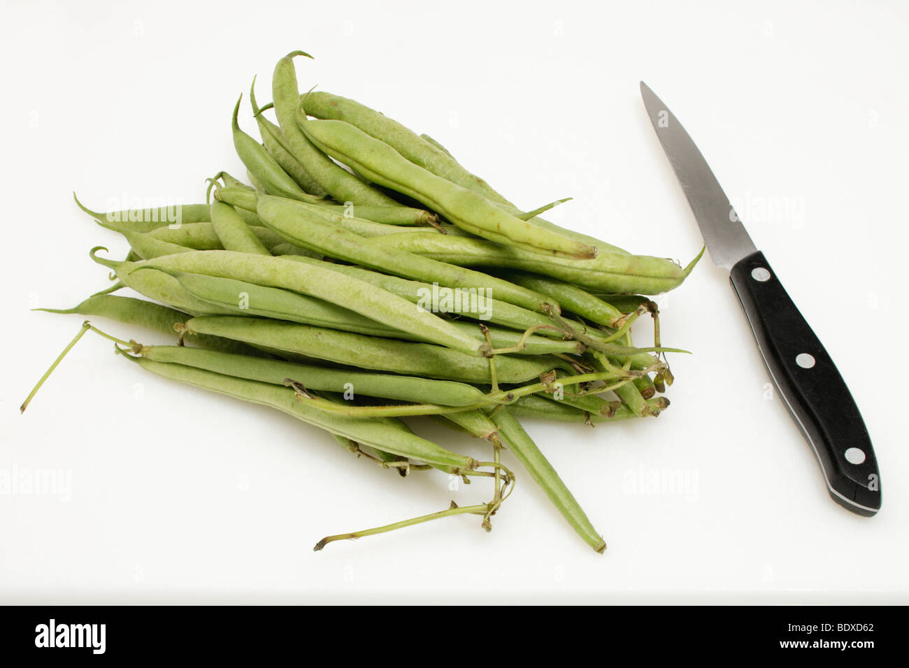 Raw green beans with a knife Stock Photo Alamy
