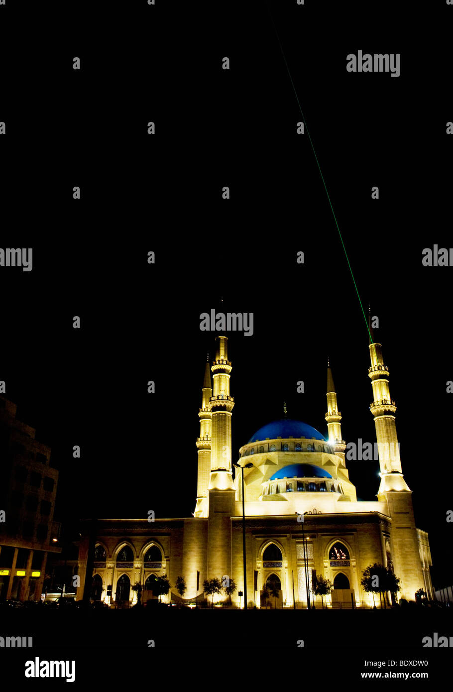 The Mohammad al-Amin mosque in Beirut, Lebanon. A green laser beam arrowing from one of the minarets is aimed towards Mecca. Stock Photo