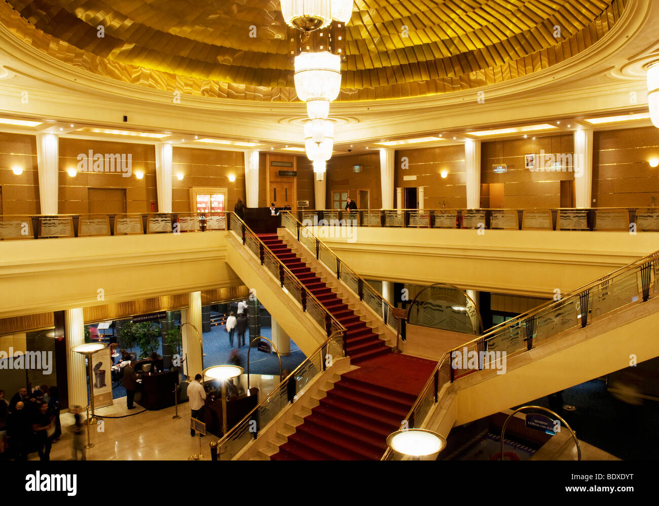The interior of Casino Du Liban, Lebanon's famed casino facility, showing the lobby and grand staircase, and a huge chandelier Stock Photo
