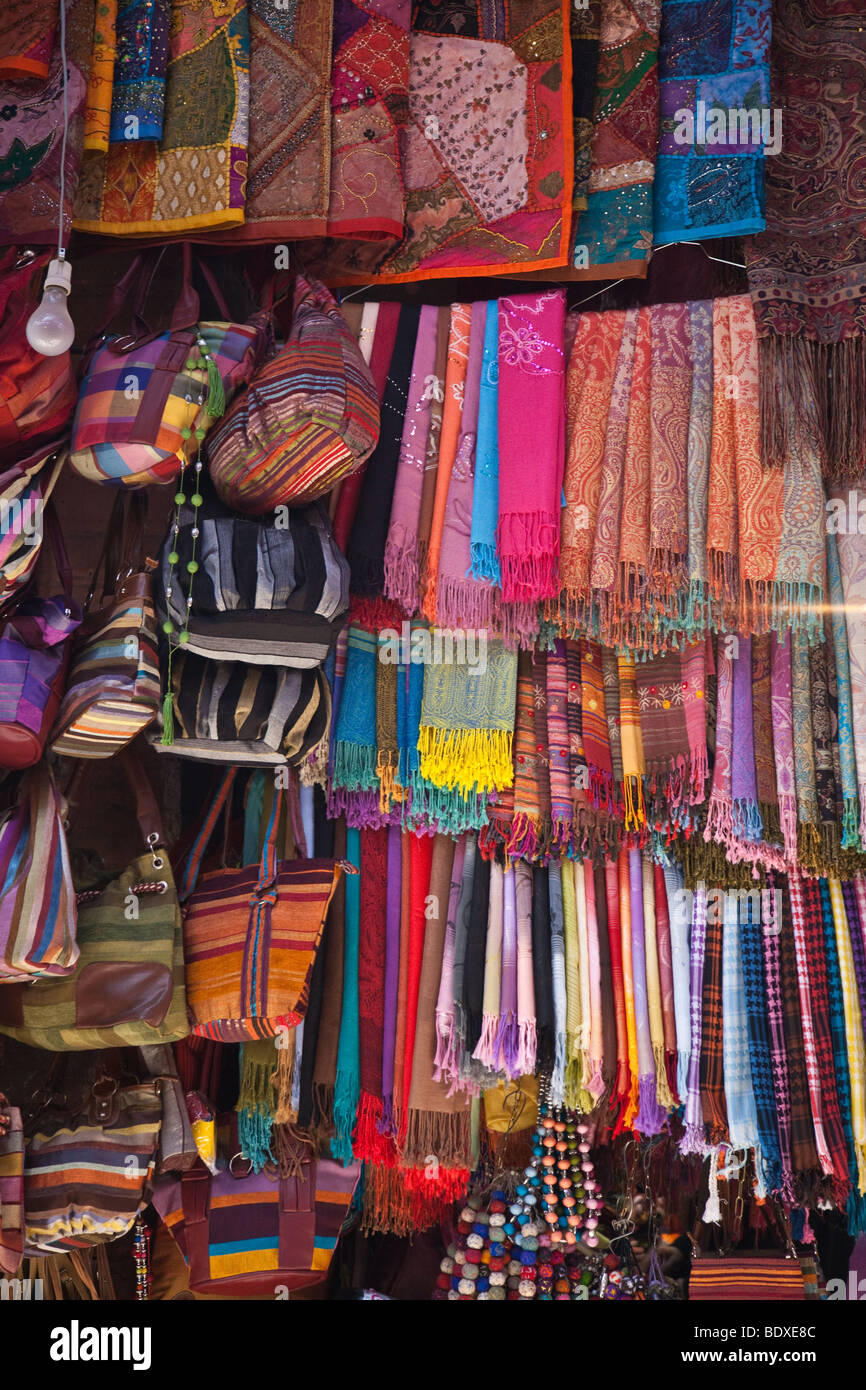 Textiles hanging in a shop of the souk in Marakech Stock Photo