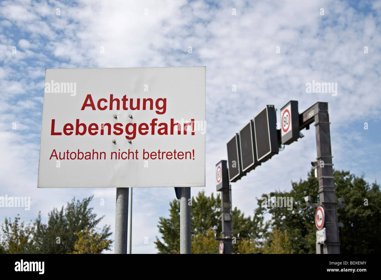 Warning sign on a highway 'Achtung Lebensgefahr! Autobahn nicht betreten!' 'Attention, mortal danger! Do not enter the highway  Stock Photo