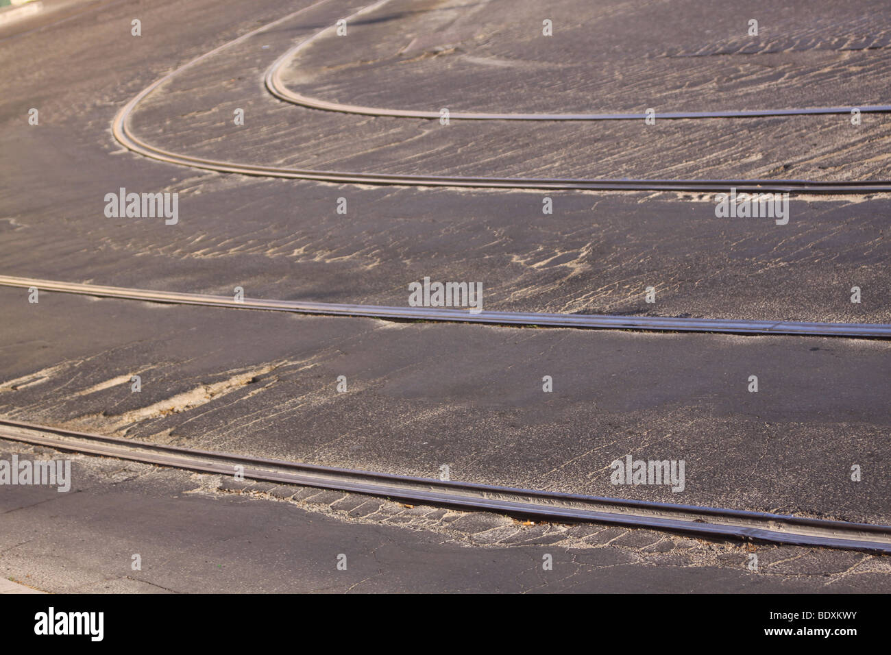 Tram tracks in cobbled damaged street Stock Photo