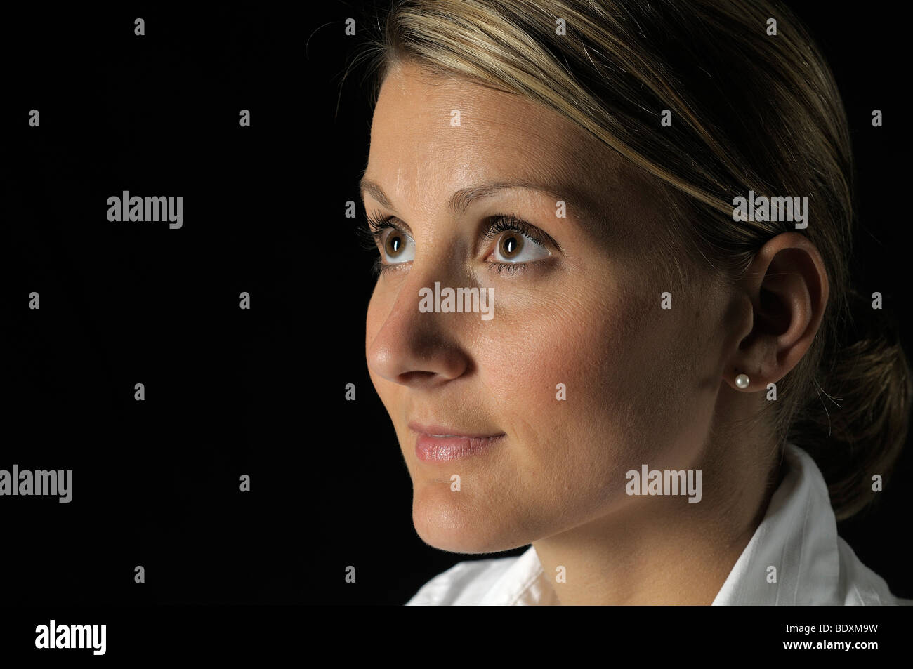 Woman's face, portrait, looking upwards Stock Photo