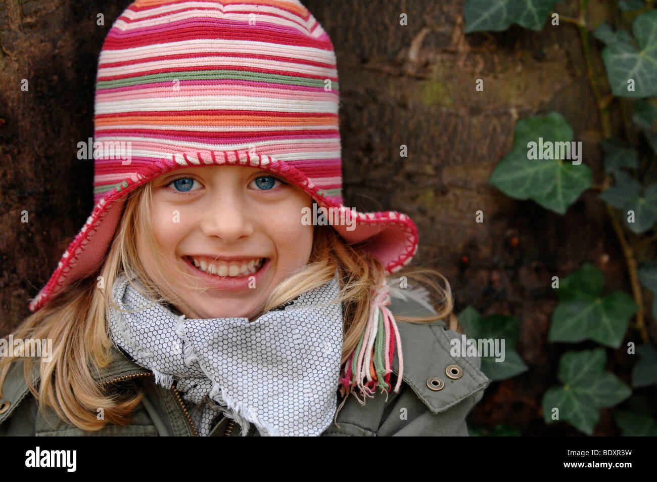 Six-year-old girl wearing a woollen hat in winter, portrait Stock Photo
