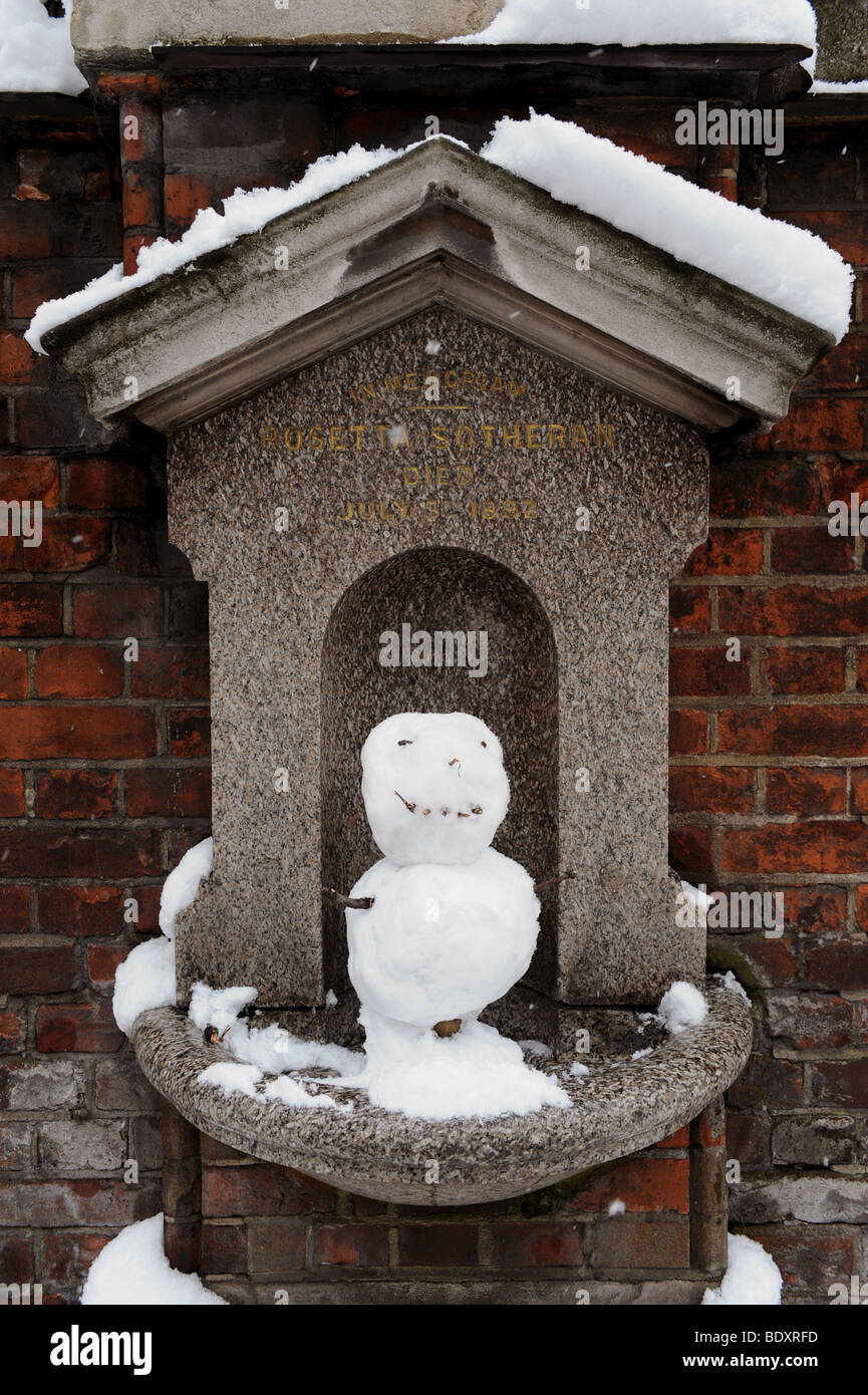 A funny snowman made in a water fountain, London. Stock Photo