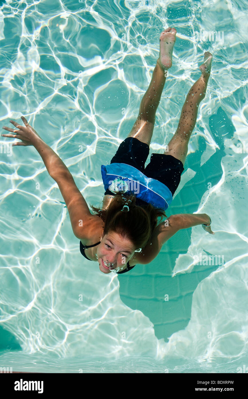 Girl diving in a pool Stock Photo Alamy