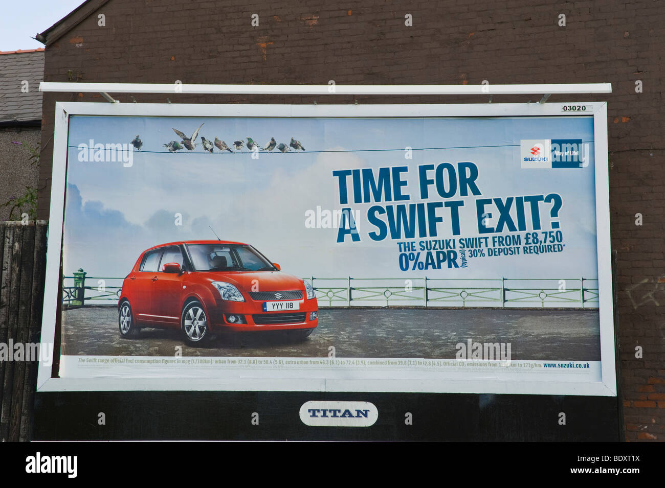 TITAN billboard for Suzuki Swift on end wall of building in UK Stock Photo