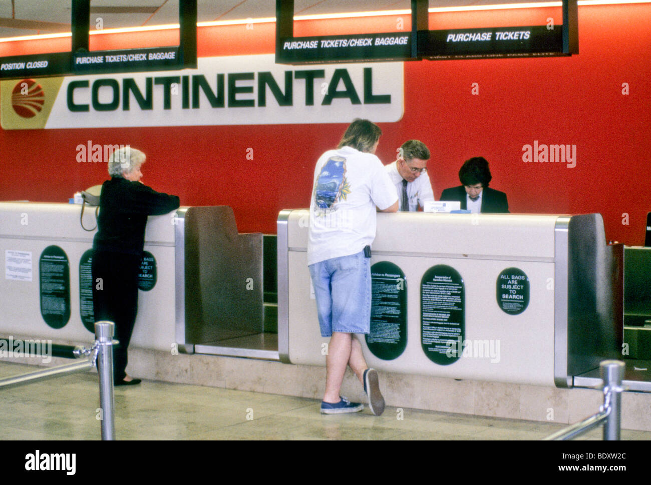 service clerk ticket line weigh scale check-in continental Stock Photo