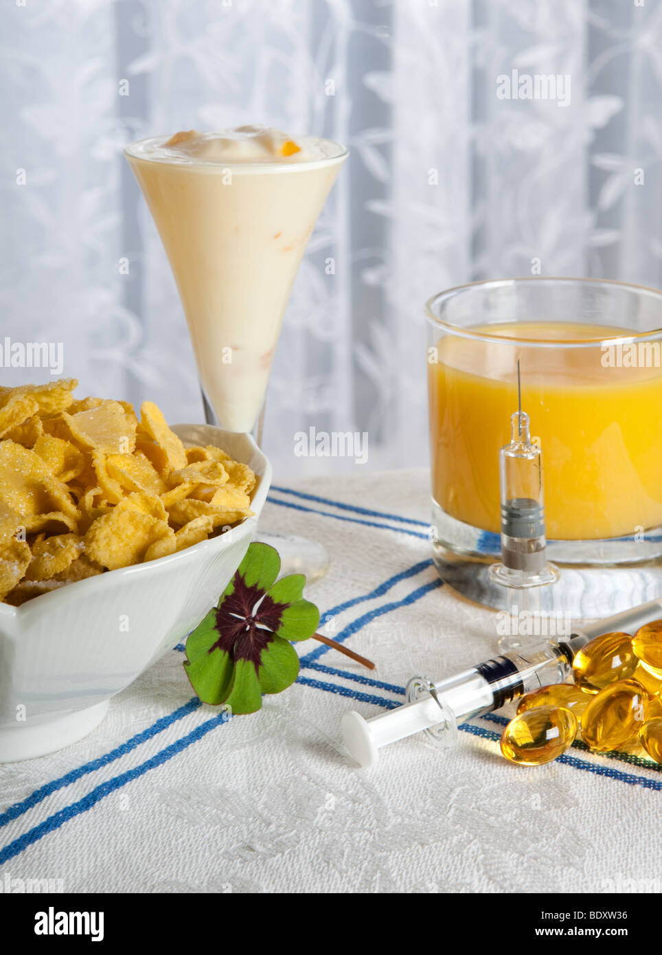Healthy anti swine flu breakfast with vitamins, flu vaccines and a lucky clover Stock Photo