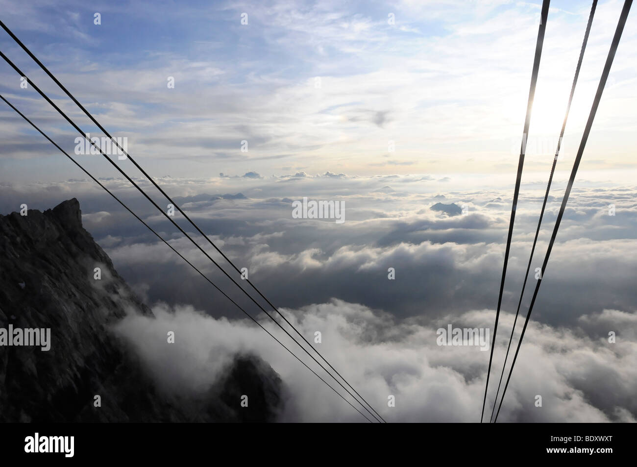 Ropes of the Tiroler Zugspitzbahnen Tyrolean Aerial Tramway in the evening light, Mt. Zugspitze, 2962 m, highest mountain in Ge Stock Photo
