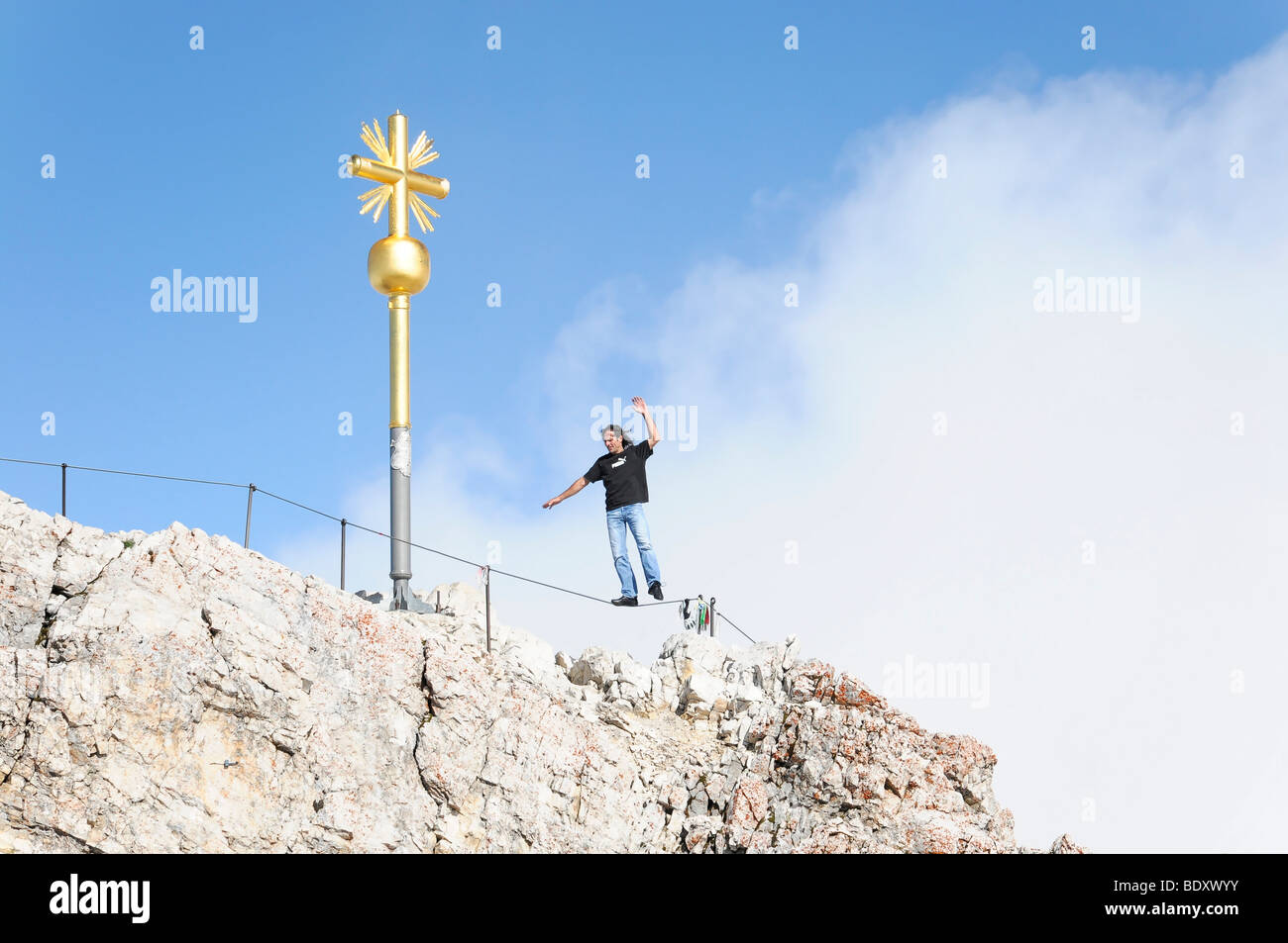 Joker at the summit cross, Mt. Zugspitze, 2962 m, highest mountain in Germany, Bavaria-Tyrol, Germany, Europe Stock Photo