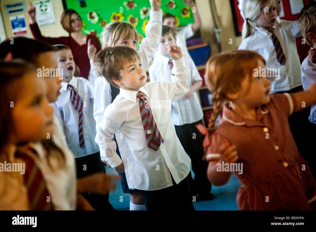 Primary school children doing morning exercise routine Stock Photo