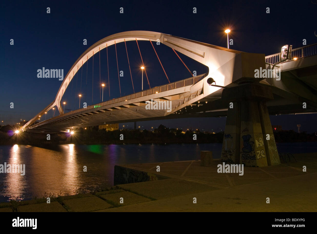 The floodlit Barqueta bridge, Puente de la Barqueta, over Guadalquivir ...