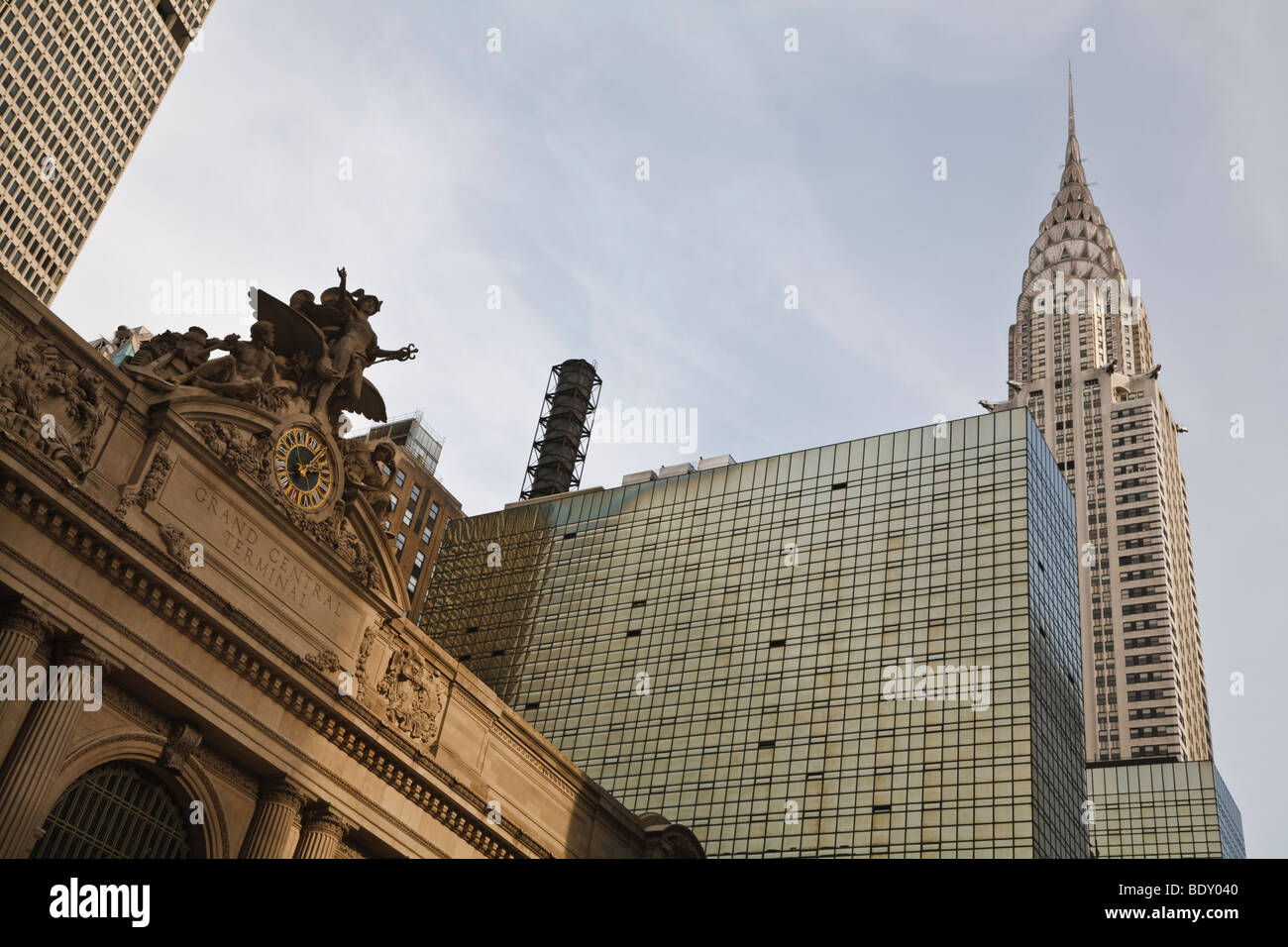 Facade of Grand Central Station, New York, with the Chrysler Building in the background Stock Photo