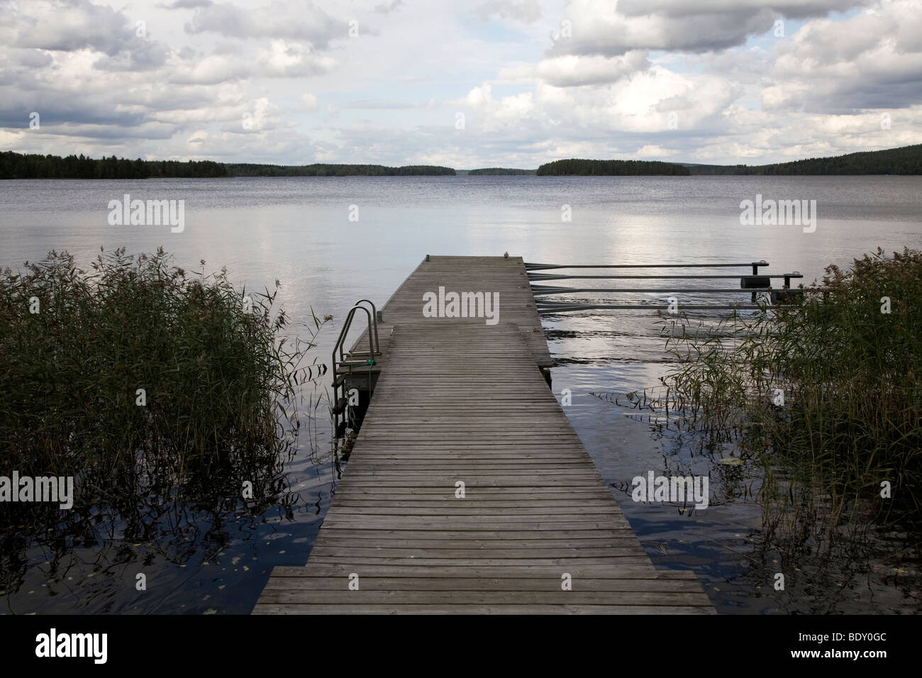 A wooden jetty on Lake Rautavasi close to the town of Vammala in the Tampere Region of Finland. Stock Photo