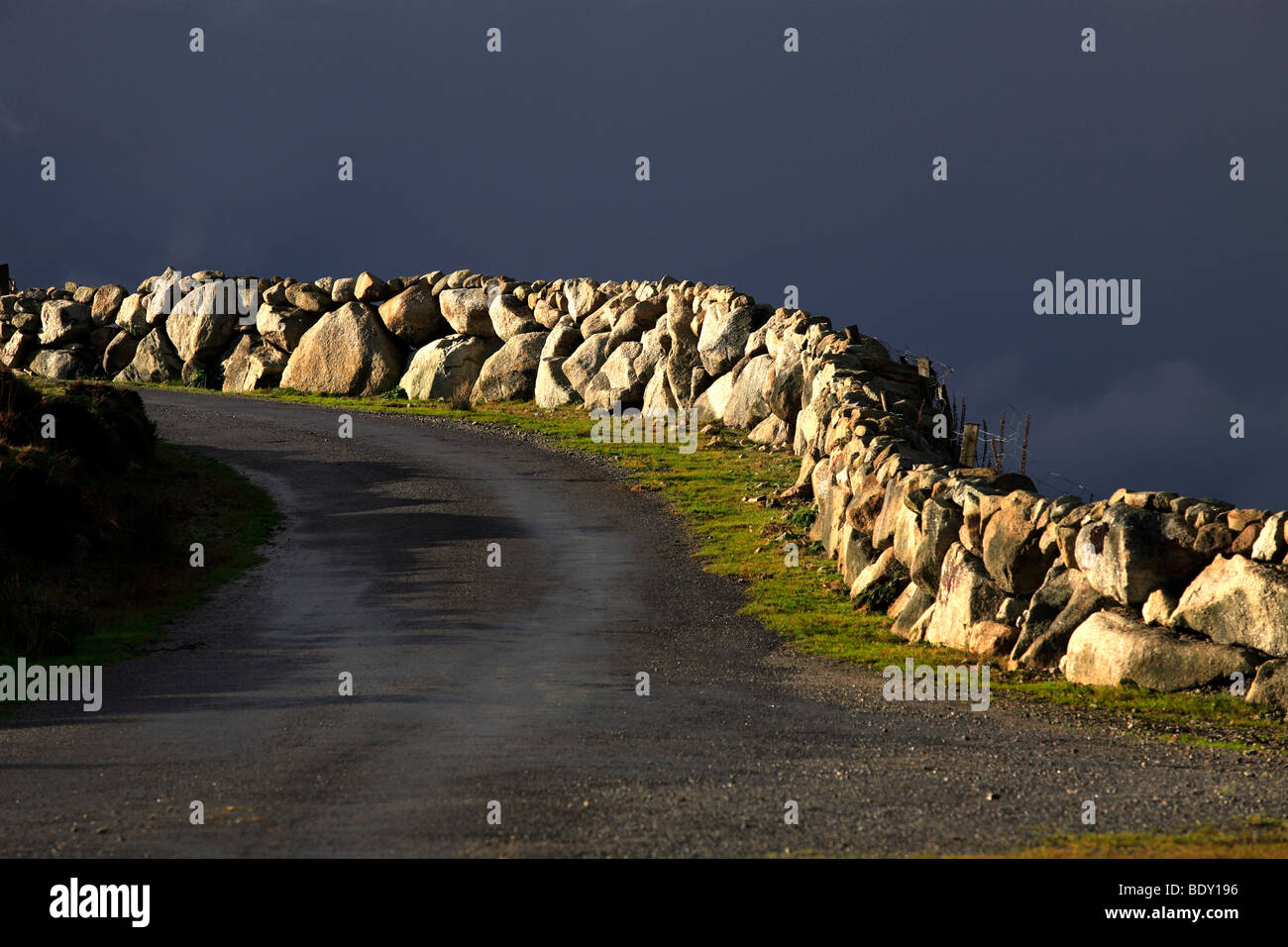 Stone Walls and Road Ireland Stock Photo