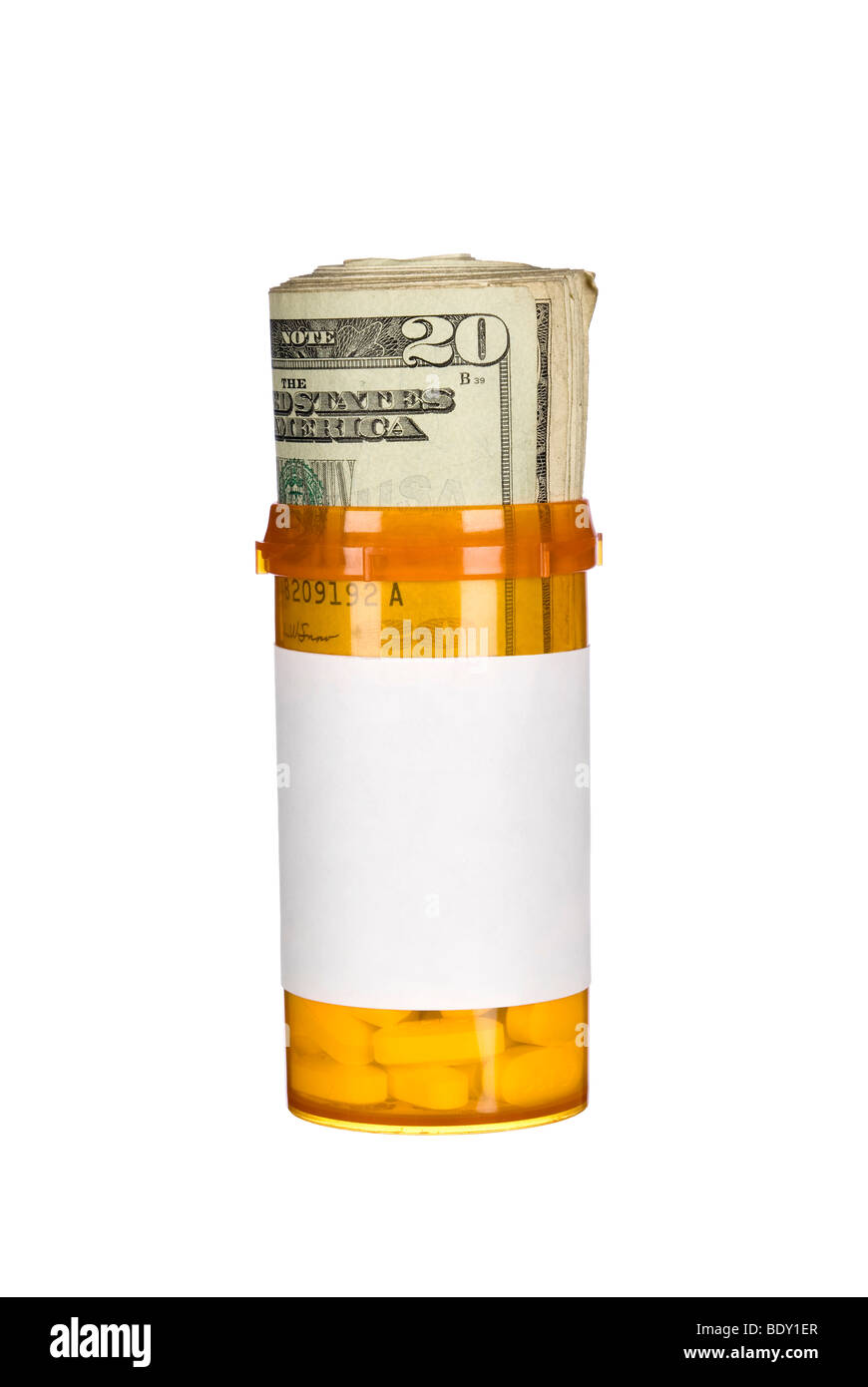 A pill bottle with pills and a roll of cash inside Stock Photo