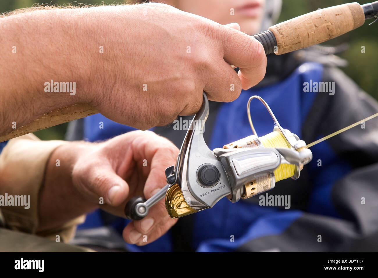 A man casts his fishing rod on Lake Rautavasi close to the town of Vammala in the Tampere Region of Finland. Stock Photo