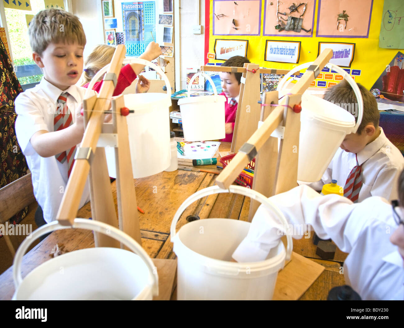 Children in a UK primary school doing a science experiment Stock Photo